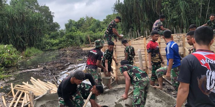 Semangat Satgas TMMD Kodim 0426 Tulang Bawang Tak Padam Meski Dihadang Rawa Dan Gambut
